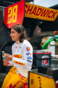 Photo of Jamie Chadwick sitting in the pits at Mid-Ohio race track