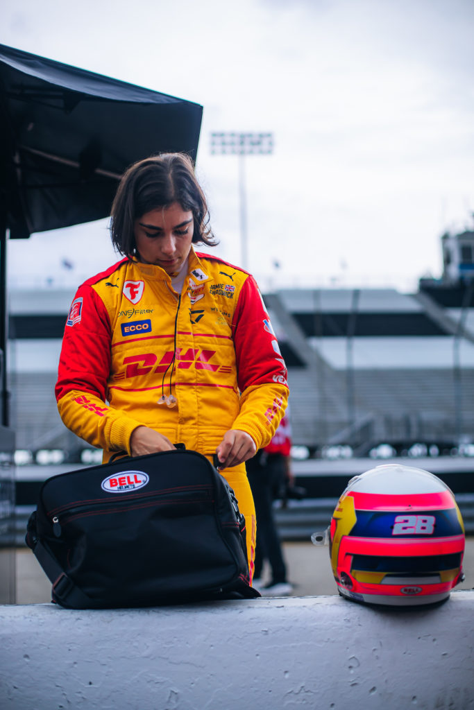 Photo of race car driver Jamie Chadwick with helmet