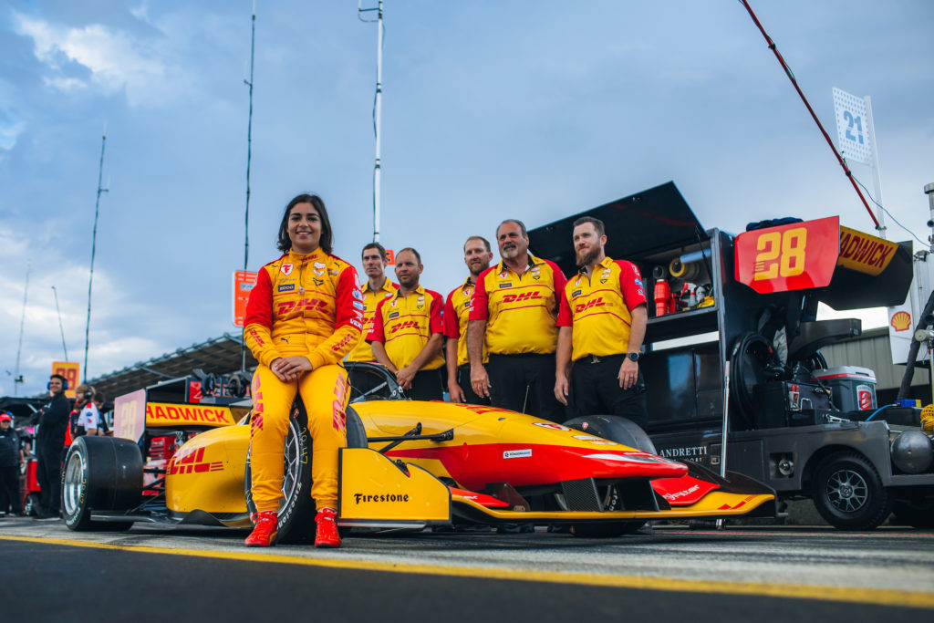 Photo of NXT driver Jamie Chadwick and team members at Laguna race track